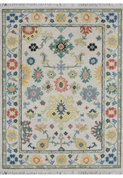 Hand knotted floral Indian rug in ivory, blue, teal and coral