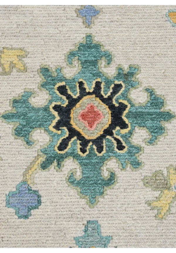 Close-up of floral central motif on hand knotted Indian rug