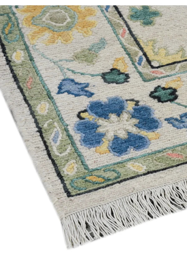 Close-up of hand knotted floral rug border and woven texture